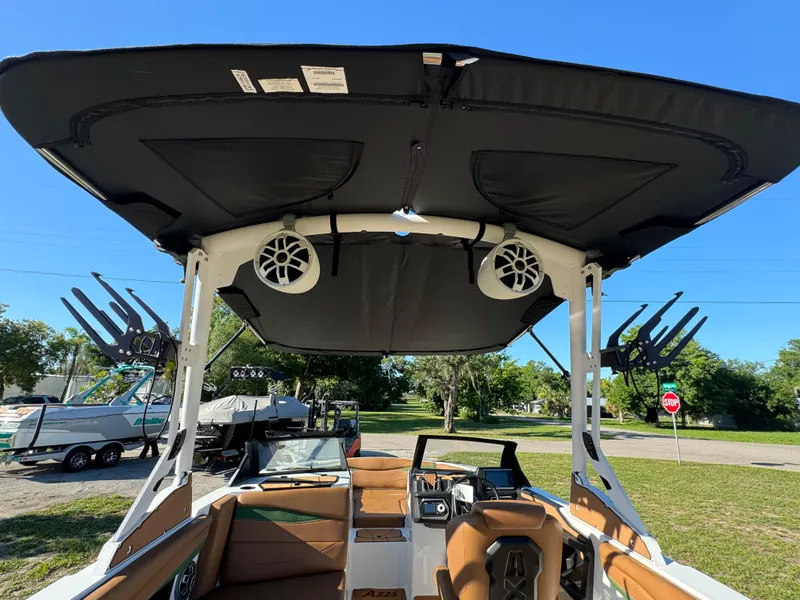 Slide: The Image of 2023 Axis A225 boat interior with speakers and wakeboard racks. - 41