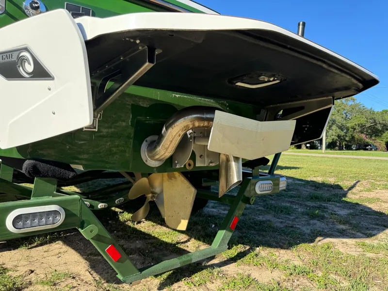 Slide: The Image of 2023 Axis A225 boat rear view showing propeller and exhaust system. - 47