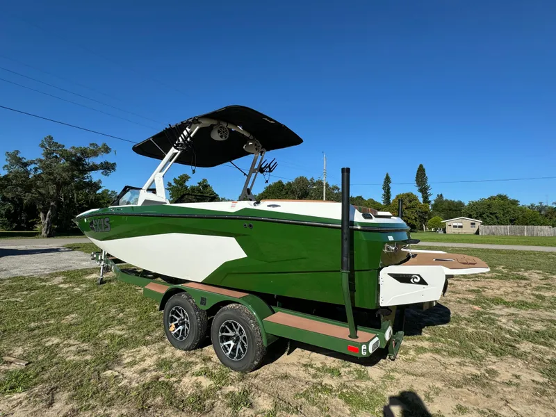 Slide: The Image of 2023 Axis A225 green and white boat on a trailer. - 6