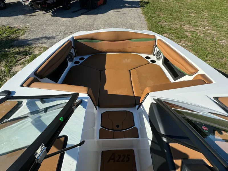 Slide: The Image of 2023 Axis A225 boat interior with tan seating and white accents. - 7