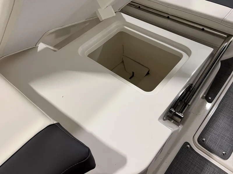 Slide: The Image of 2023 Bayliner VR5 Bowrider storage compartment with open lid. - 12
