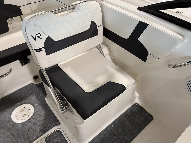 Slide: The Image of 2023 Bayliner VR5 Bowrider interior seating with black and white upholstery. - 13