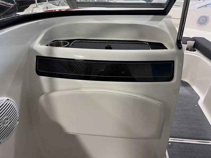 Slide: The Image of 2023 Bayliner VR5 Bowrider interior detail with cup holder and speaker. - 14