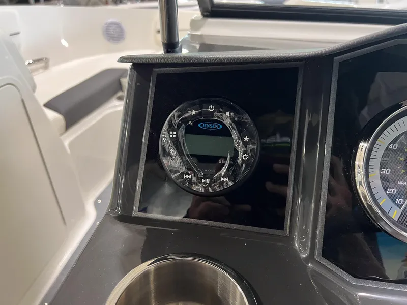 Slide: The Image of 2023 Bayliner VR5 Bowrider dashboard with Jensen audio system and speedometer. - 17