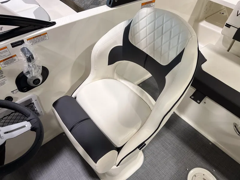 Slide: The Image of Captain's seat of 2023 Bayliner VR5 Bowrider boat with diamond-stitched upholstery. - 6