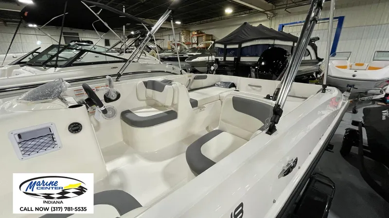 Slide: The Image of 2025 Bayliner E18LE boat interior at Marine Center, Indiana showroom. - 9