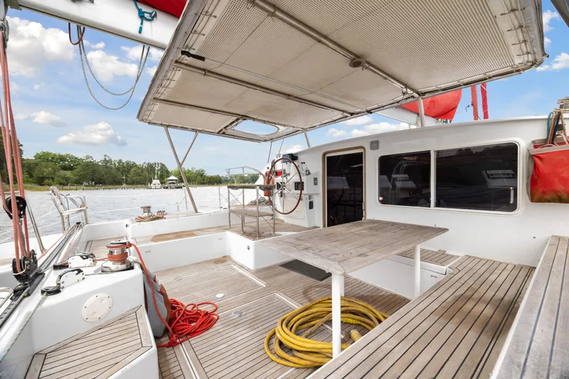 Slide: The Image of Deck view of a 2006 Switch 55 catamaran with seating and storage. - 10