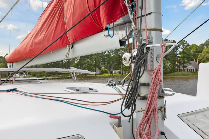 Slide: The Image of Close-up of 2006 Switch 55 sailboat deck with red sail and rigging. - 30