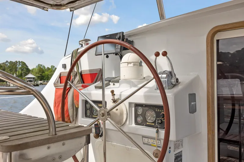 Slide: The Image of Helm of 2006 Switch 55 sailboat with wooden wheel and navigation instruments. - 34