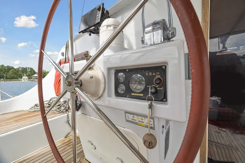 Slide: The Image of Steering wheel and control panel of a 2006 Switch 55 sailboat. - 36