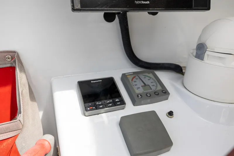 Slide: The Image of Boat control panel of a 2006 Switch 55 with navigation instruments. - 40