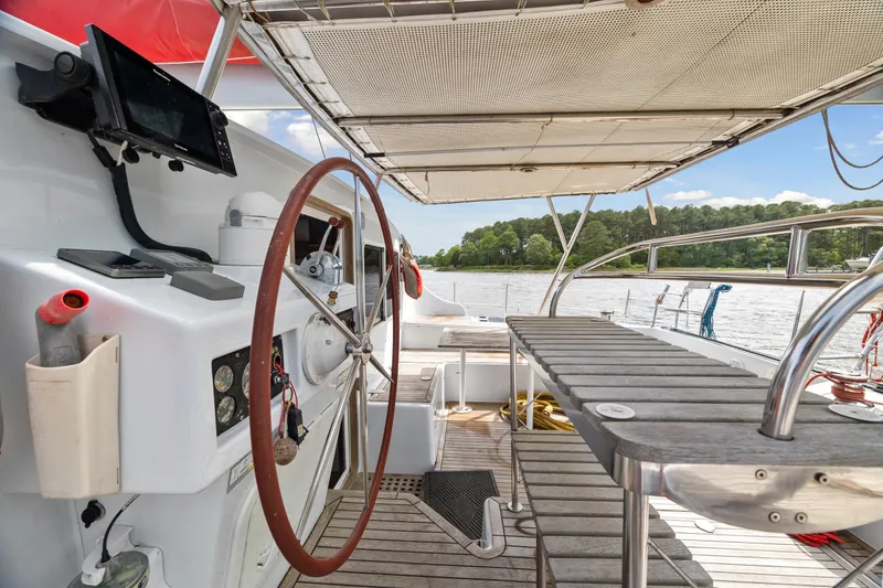 Slide: The Image of Cockpit of 2006 Switch 55 catamaran with steering wheel and navigation equipment. - 42