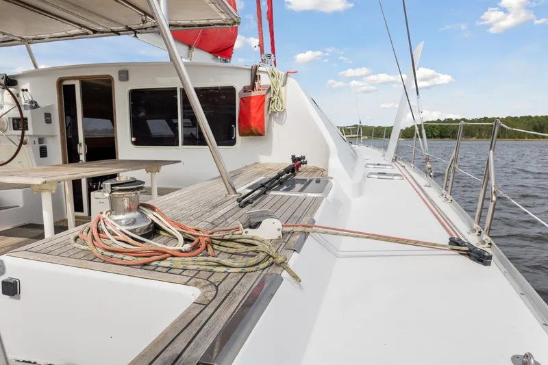Slide: The Image of Sailboat deck of a 2006 Switch 55 with ropes and equipment. - 49