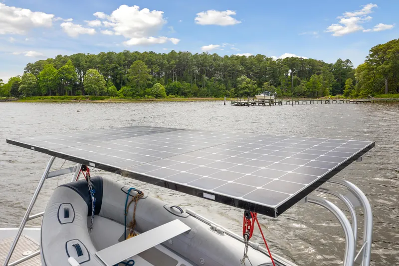 Slide: The Image of Solar panel on a boat with scenic lake and forest background, Switch 55, 2006. - 9