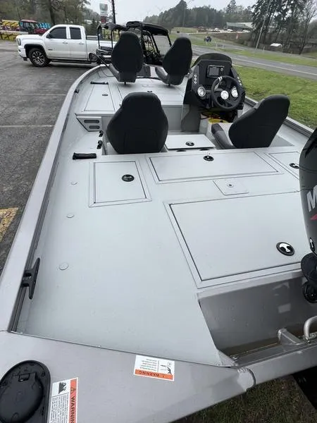 Slide: The Image of 2023 Crestliner XFC 179 fishing boat with spacious deck and seating. - 4