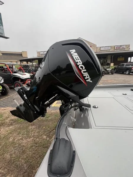 Slide: The Image of 2023 Crestliner XFC 179 with Mercury outboard motor, parked outdoors. - 8