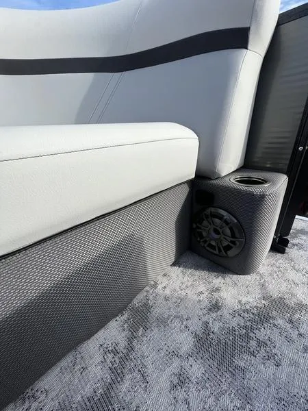 Slide: The Image of 2023 Crest Classic LX 200 L boat interior with speaker and cup holder. - 3