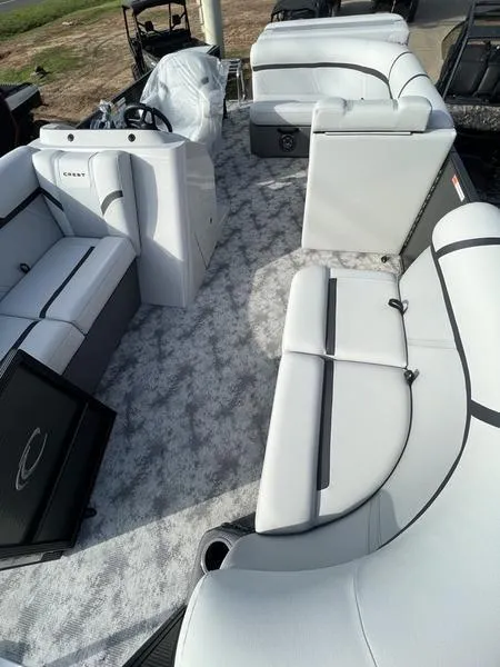 Slide: The Image of 2023 Crest Classic LX 200 L pontoon boat with spacious seating and modern design. - 7
