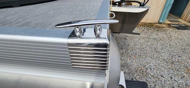 Slide: The Image of 2023 Bennington 23 SXSR boat cleat on aluminum deck, close-up view. - 9
