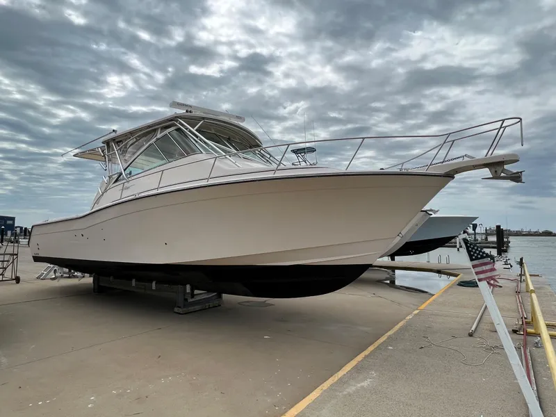 The Image of 2007 Grady-White Express 360 boat on dock under cloudy sky. - 0