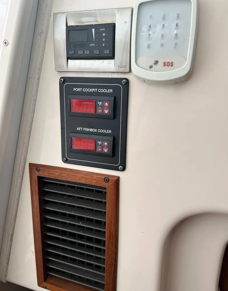 Slide: The Image of Control panel on a 2007 Grady-White Express 360 boat, featuring coolers and ventilation. - 30