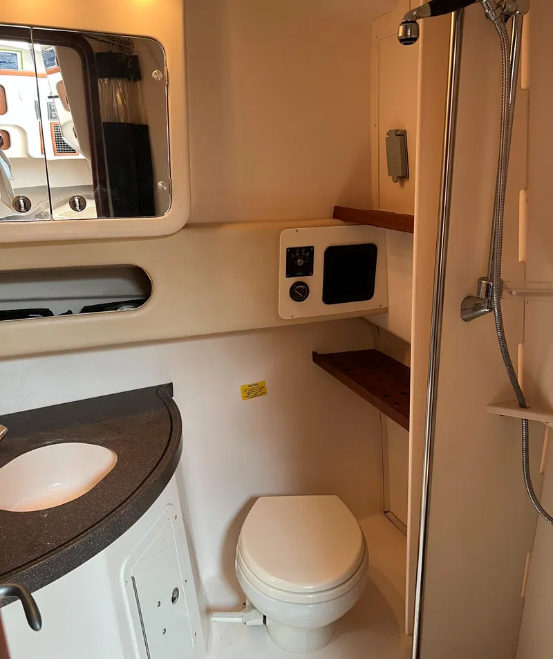 Slide: The Image of 2007 Grady-White Express 360 boat bathroom with shower, sink, and toilet. - 34