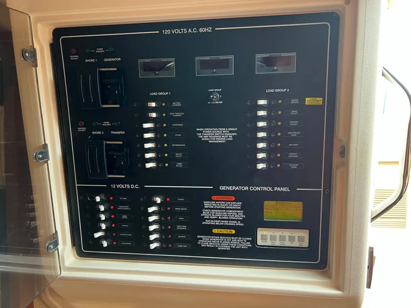 Slide: The Image of Electrical control panel on a 2007 Grady-White Express 360 boat. - 37