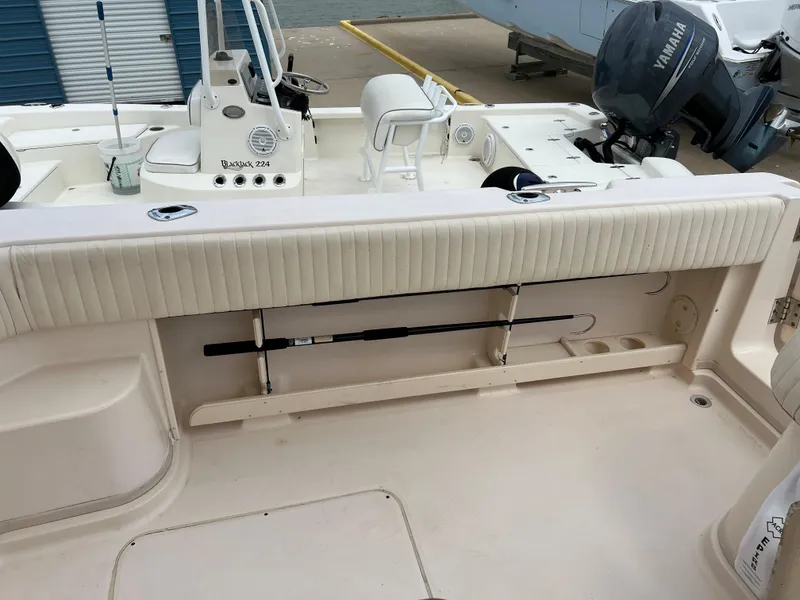 Slide: The Image of 2007 Grady-White Express 360 boat interior with Yamaha engine, featuring fishing rod storage. - 43