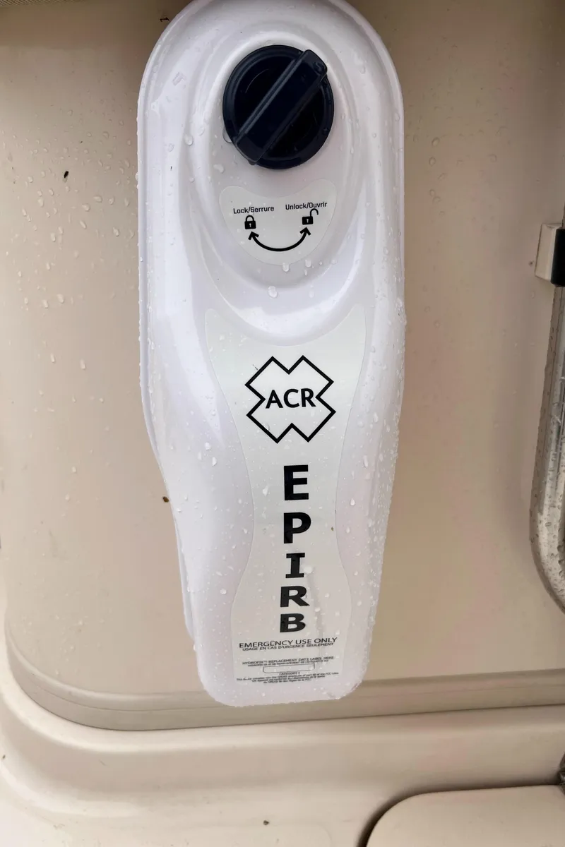 Slide: The Image of ACR EPIRB on 2007 Grady-White Express 360 boat, safety equipment detail. - 44