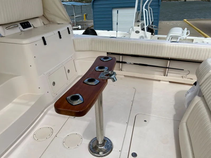 Slide: The Image of 2007 Grady-White Express 360 boat interior with rod holders and seating. - 47