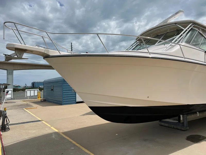 Slide: The Image of 2007 Grady-White Express 360 boat on dry dock under cloudy sky. - 5