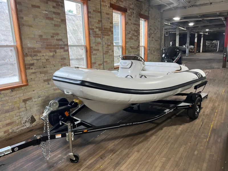 Slide: The Image of 2023 Walker Bay Generation 450 boat on trailer in indoor setting. - 4