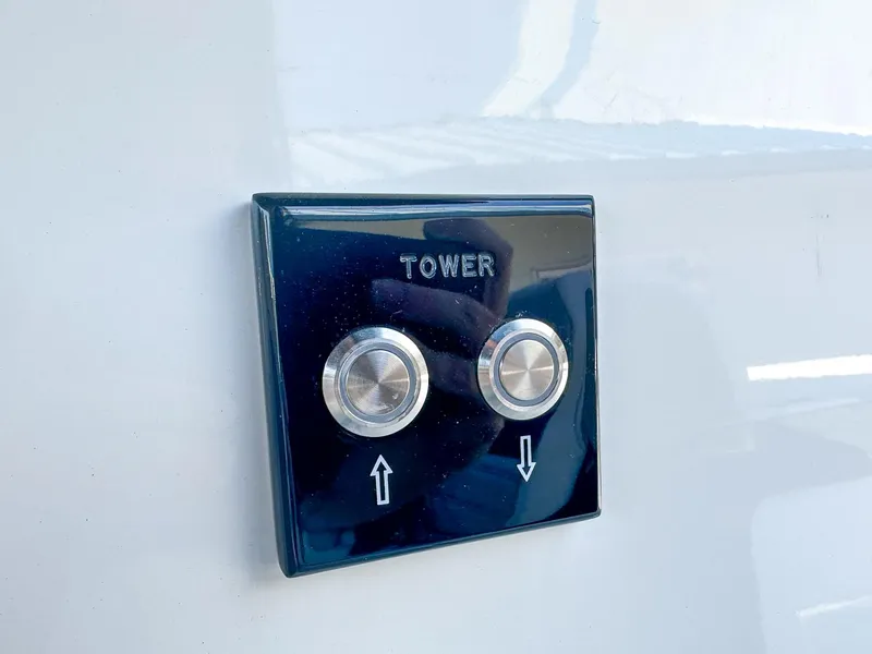 Slide: The Image of Control panel for tower adjustment on 2023 Sea Ray SLX 260 Outboard boat. - 16