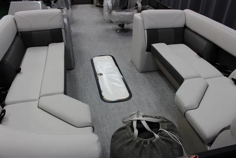 Slide: The Image of Interior of 2023 Harris Cruiser 250 CWDH pontoon boat with spacious seating. - 3