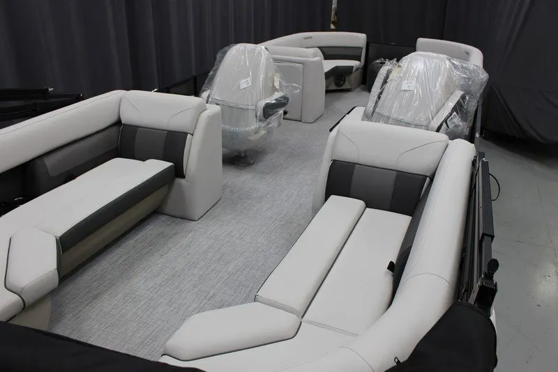 Slide: The Image of 2023 Harris Cruiser 250 CWDH pontoon boat interior with plush seating. - 4