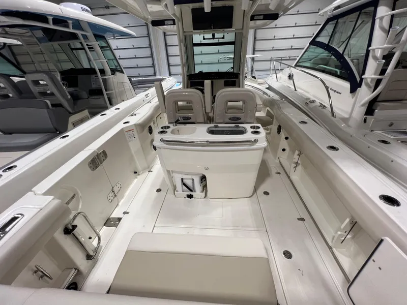 Slide: The Image of 2025 Boston Whaler 280 Outrage interior, showcasing spacious seating and modern design. - 2
