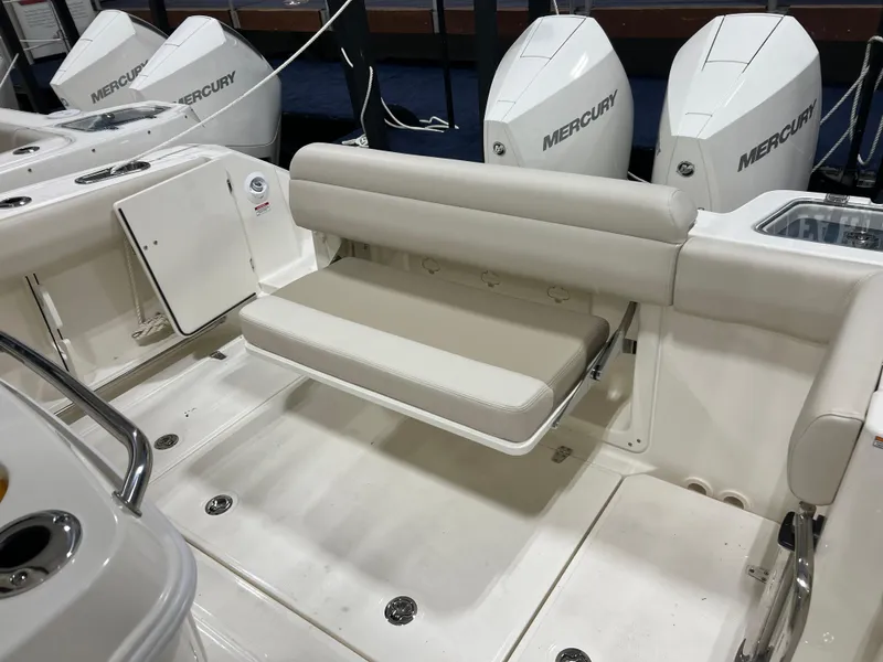 Slide: The Image of 2025 Boston Whaler 280 Outrage boat with Mercury engines and foldable seating. - 4