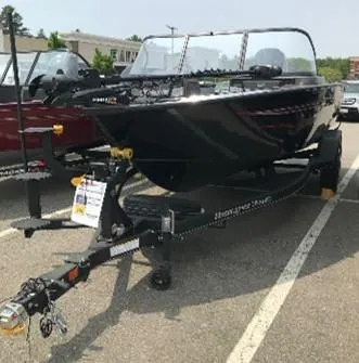 Slide: The Image of 2023 Ranger VX1888 WT boat on a trailer in a parking lot. - 3
