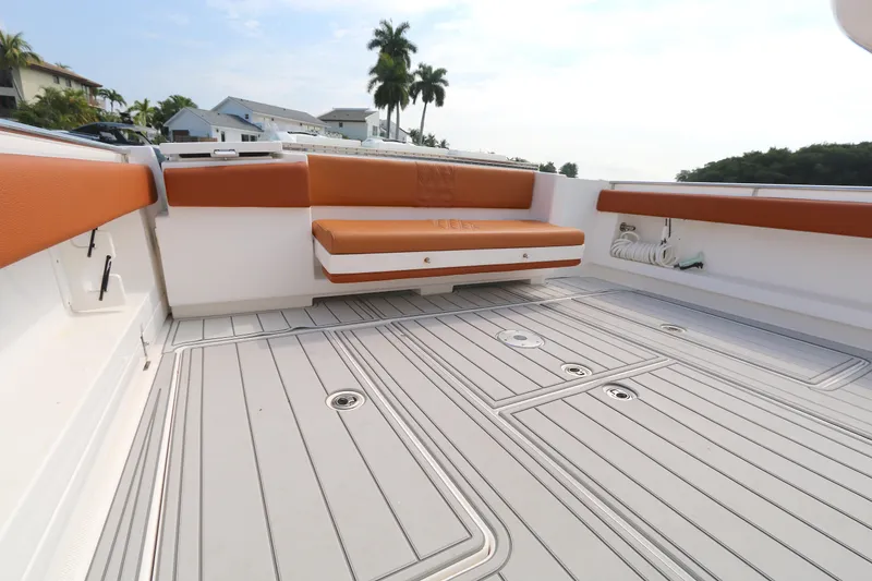 Slide: The Image of 2018 Belzona 327wa boat deck with orange seating and sleek flooring. - 10