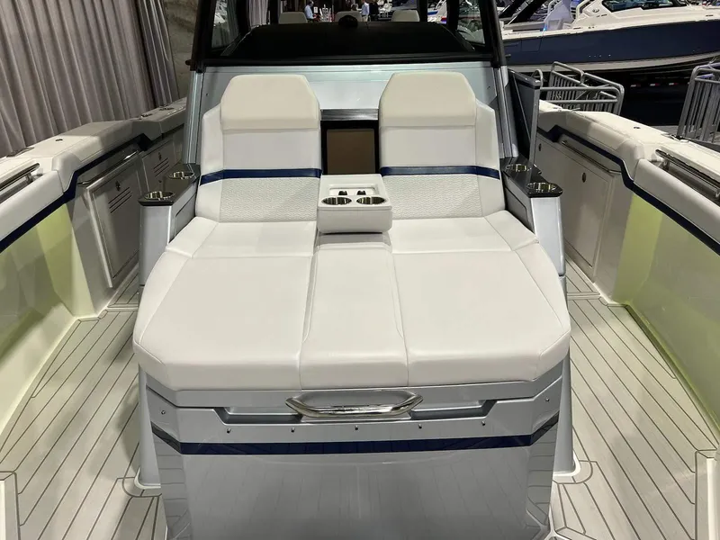 Slide: The Image of 2023 Formula 387 Center Console Sport boat with sleek white seating and modern design. - 10
