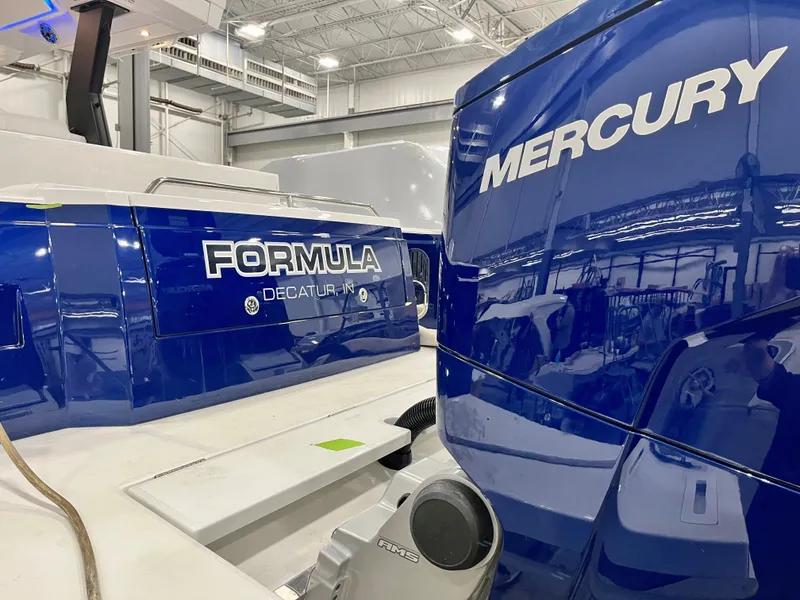 Slide: The Image of 2023 Formula 387 Center Console Sport boat with Mercury engine in showroom. - 11