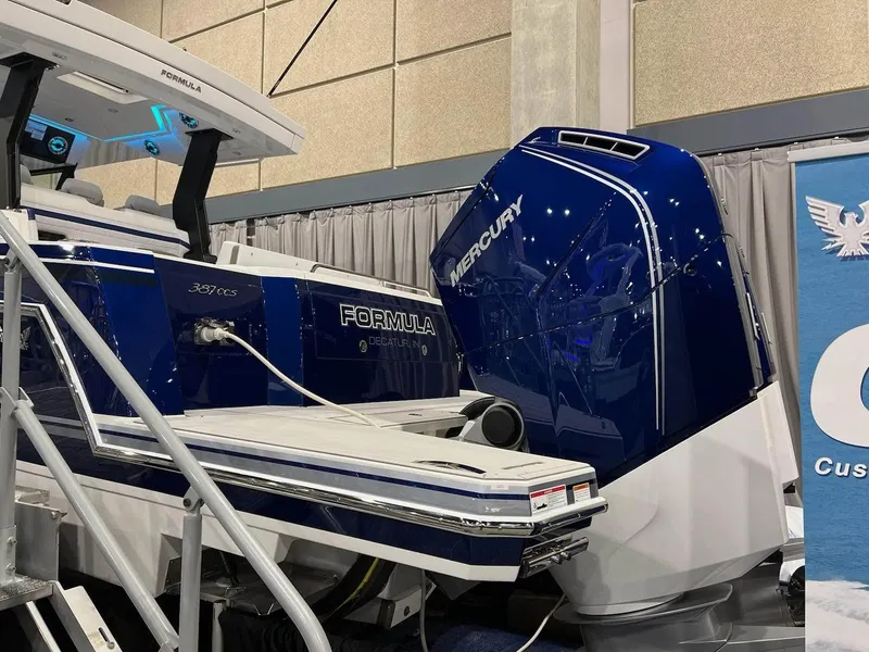 Slide: The Image of 2023 Formula 387 Center Console Sport boat with Mercury engine at a boat show. - 3