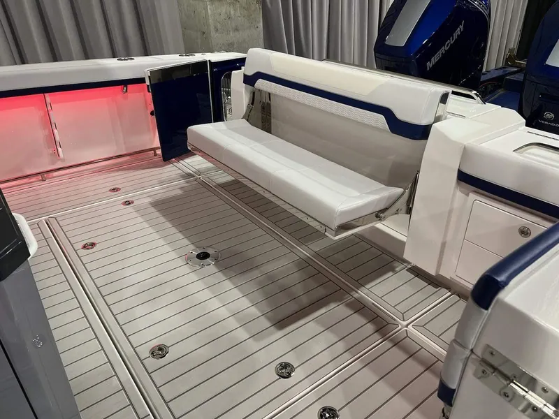 Slide: The Image of 2023 Formula 387 Center Console Sport boat interior with foldable seating and modern design. - 4