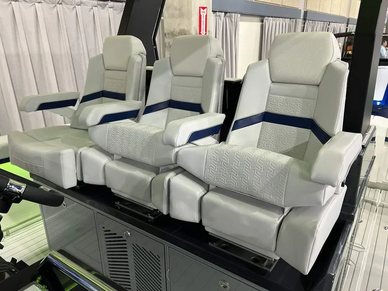 Slide: The Image of 2023 Formula 387 Center Console Sport boat seats, luxurious white and blue design. - 6