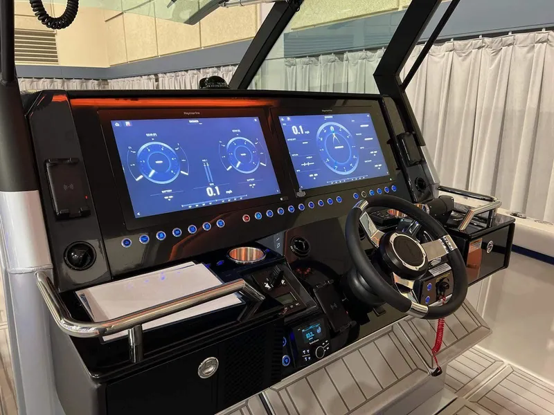 Slide: The Image of 2023 Formula 387 Center Console Sport dashboard with dual digital displays and modern controls. - 7