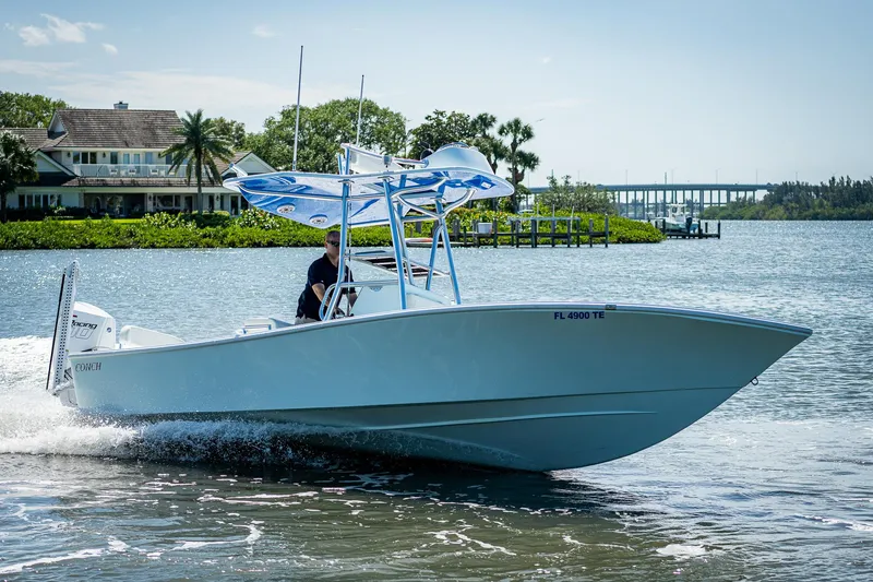 Slide: The Image of 2022 Conch Bay Boat cruising on a scenic waterway. - 17
