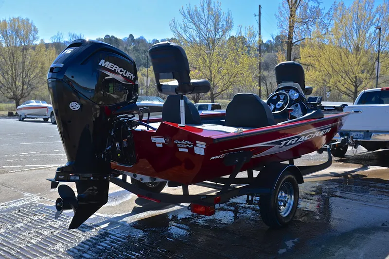 Slide: The Image of 2021 Tracker 175 TXW boat with Mercury engine in a parking lot. - 14