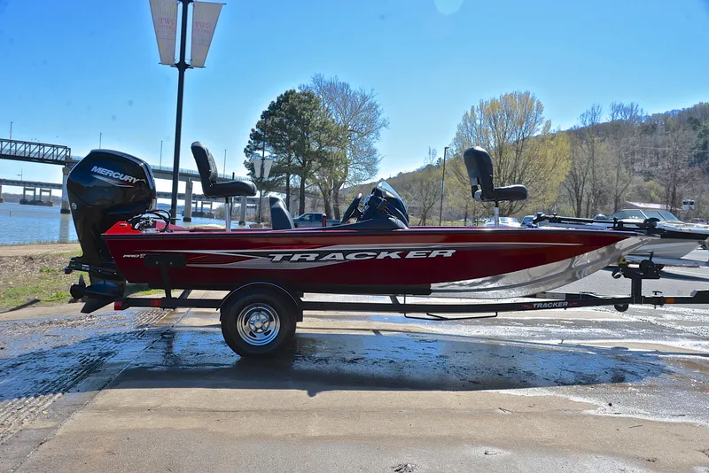 Slide: The Image of 2021 Tracker 175 TXW fishing boat on trailer by riverside. - 15