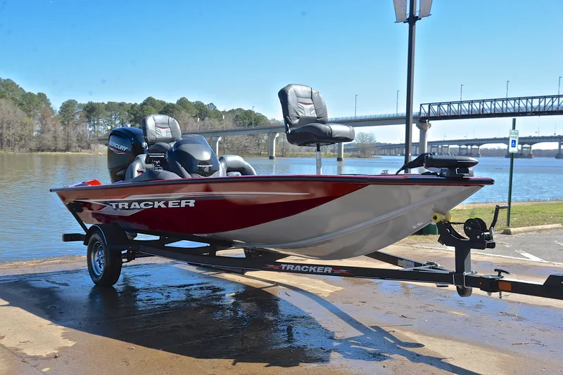 Slide: The Image of 2021 Tracker 175 TXW boat on trailer by a river, ready for fishing. - 16