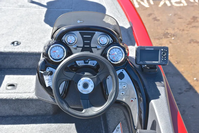 Slide: The Image of 2021 Tracker 175 TXW boat dashboard with steering wheel and gauges. - 23